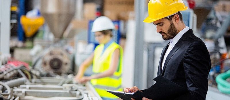 Site engineer and manager inspecting works